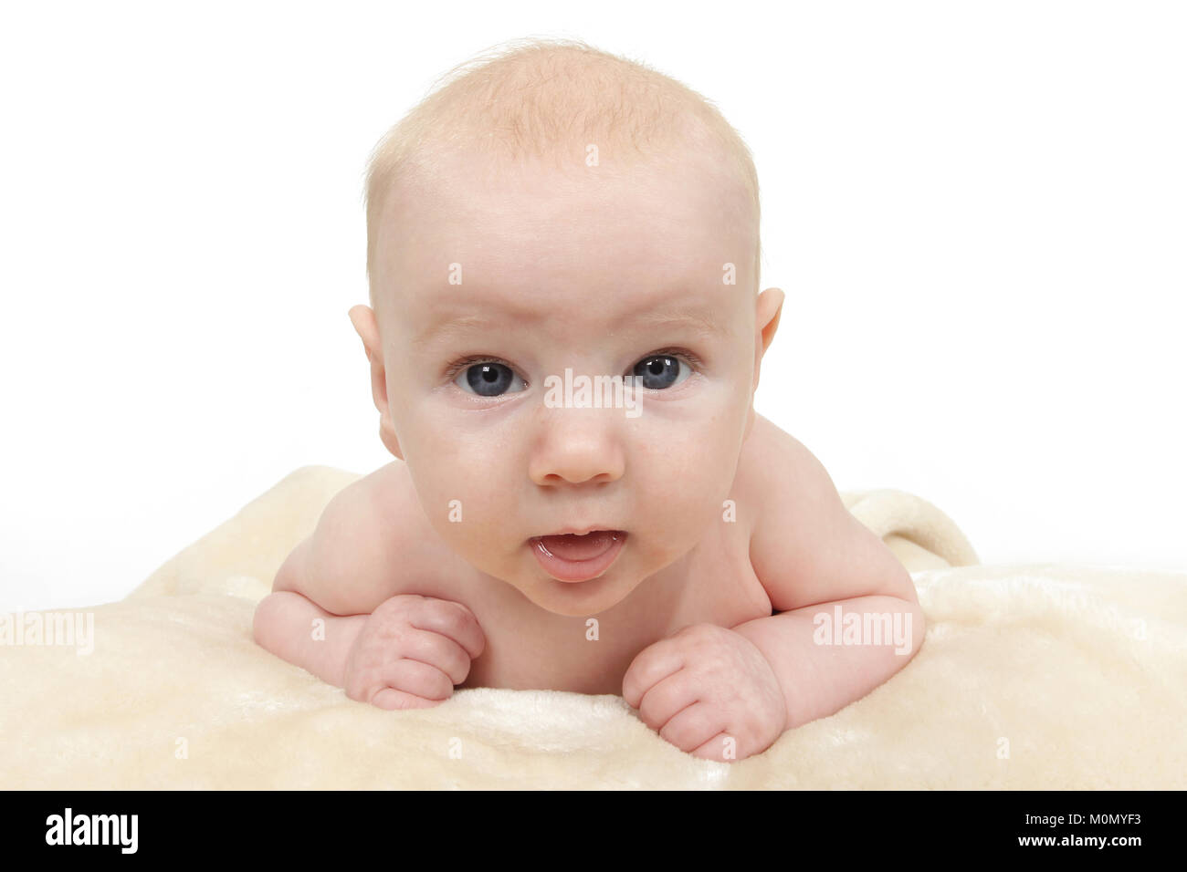 baby boy laying on tummy, crawling Stock Photo Alamy
