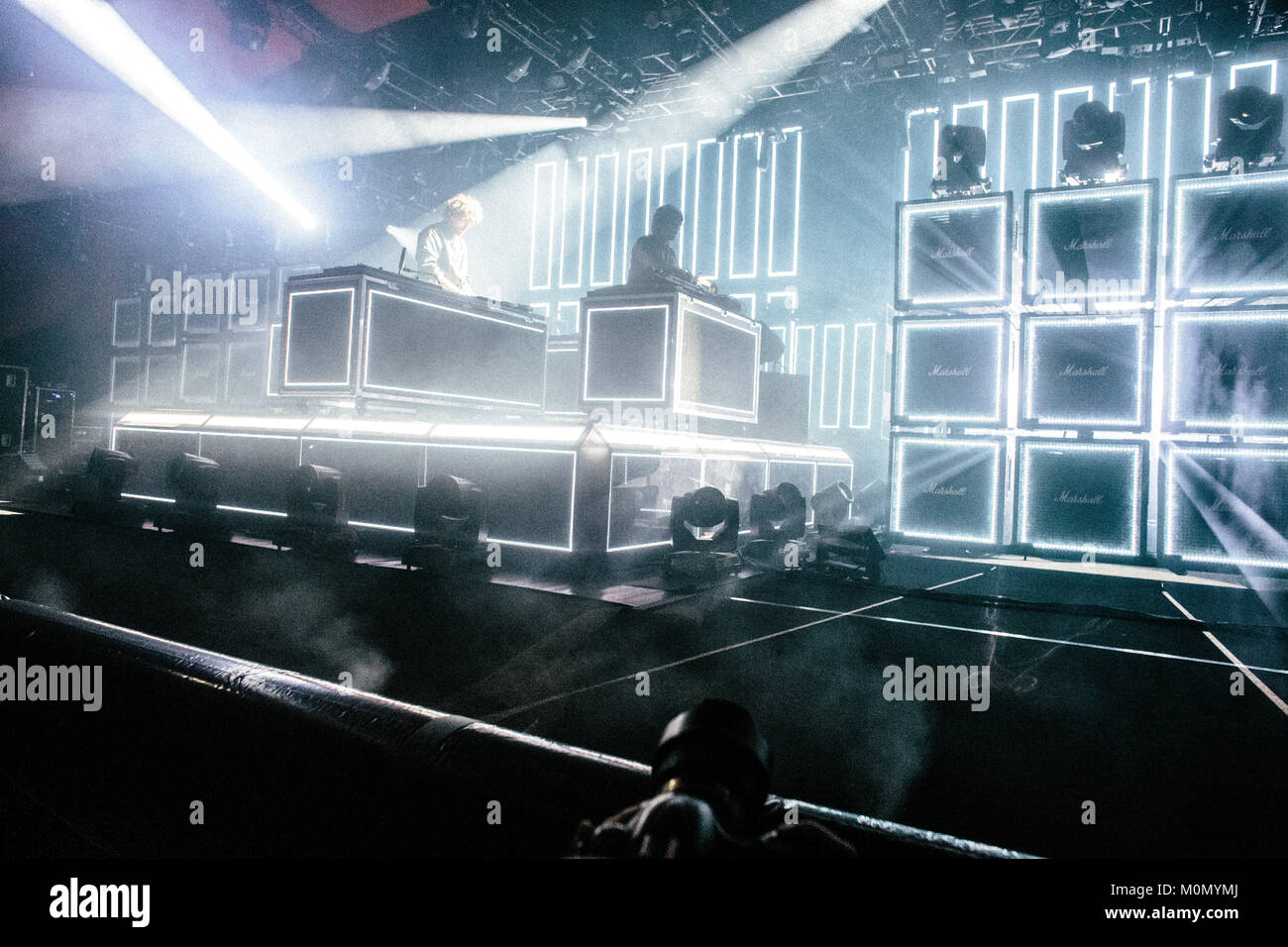 The French electronic music duo Justice (stylised as Jus†ice) performs