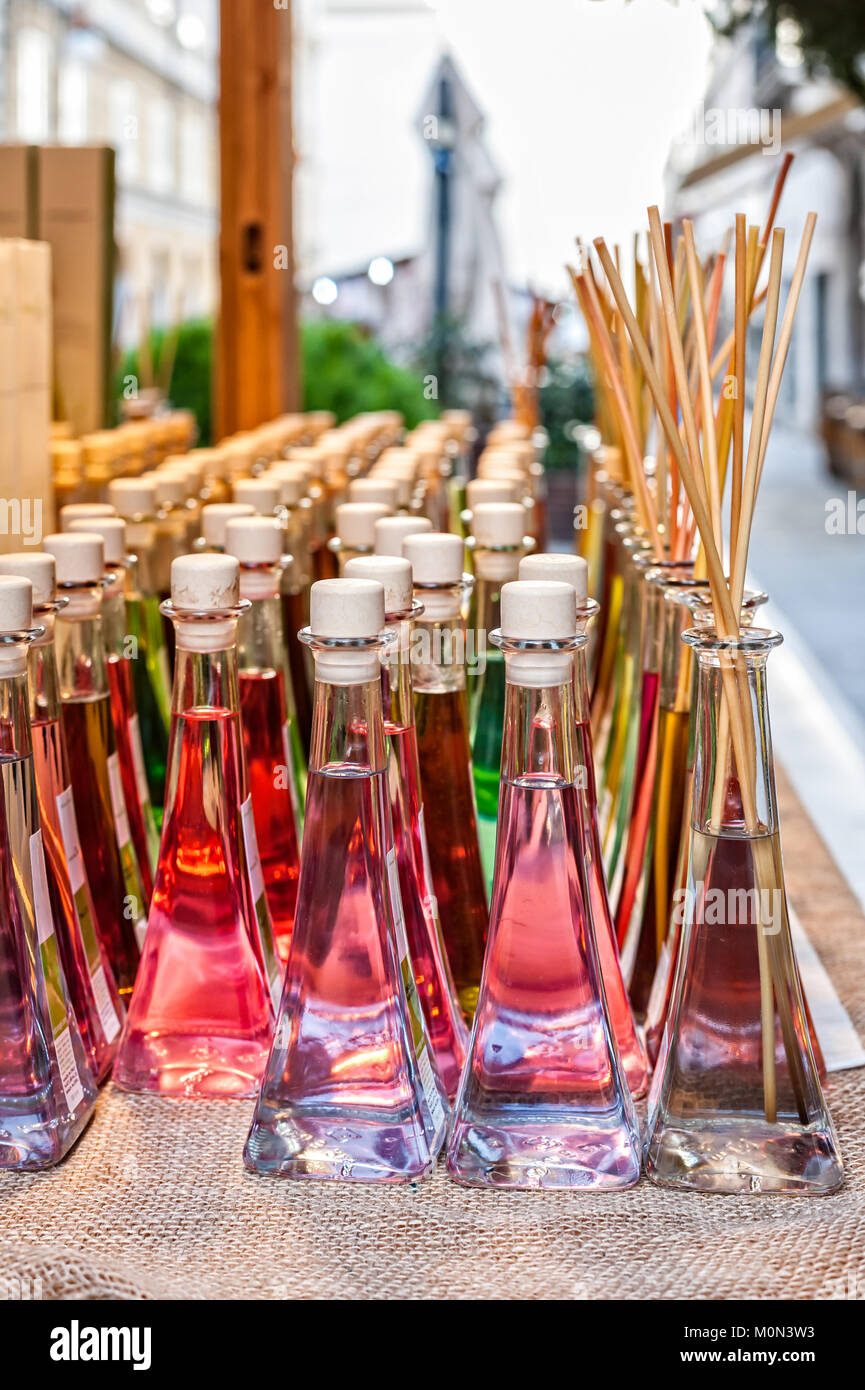 Colored bottles of fragrances with sticks for the fragrance of the house. Stock Photo