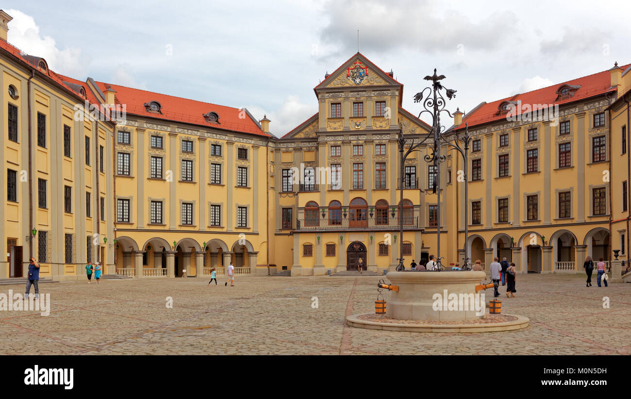 Nesvizh, Belarus - August 27, 2012: People in the courtyard of residential castle of the Radziwill family. After reconstruction, since 2006 the castle Stock Photo