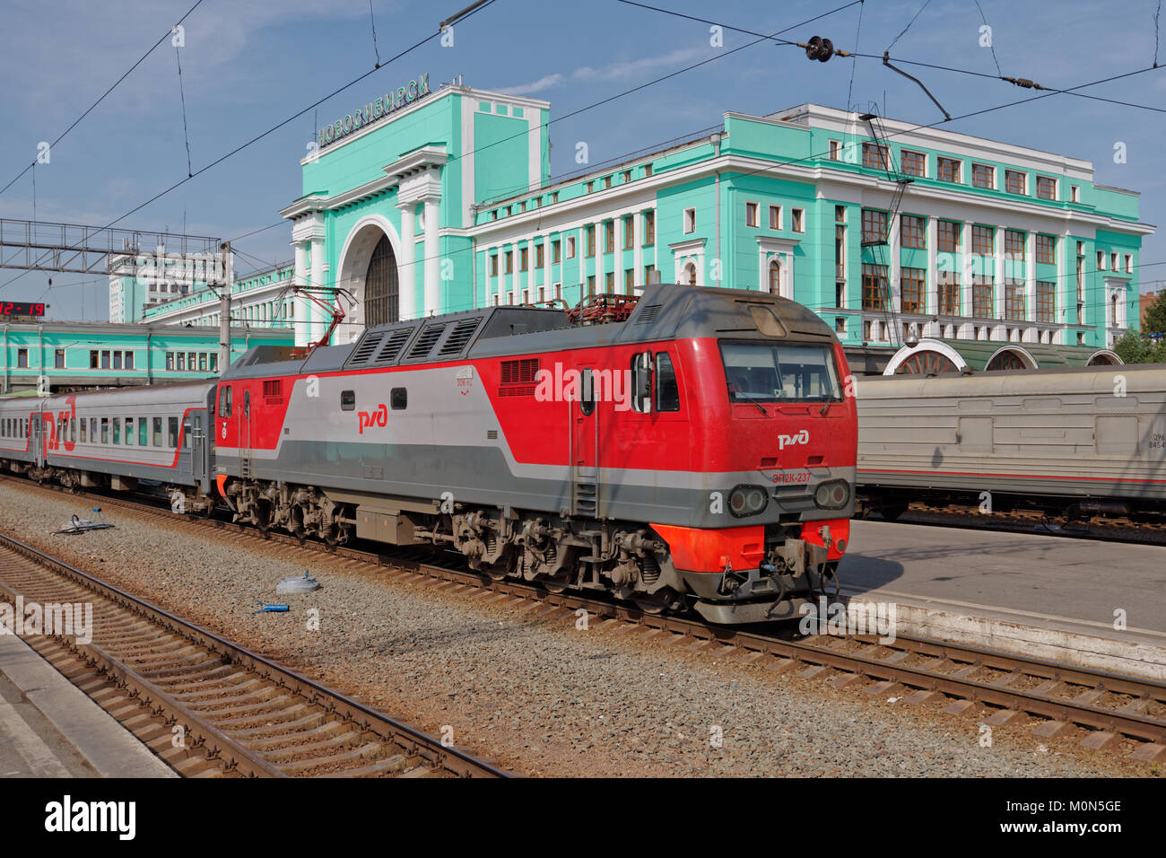 Novosibirsk, Russia - August 25, 2014: Passenger train arriving on the main railroad station of Novosibirsk. Stock Photo