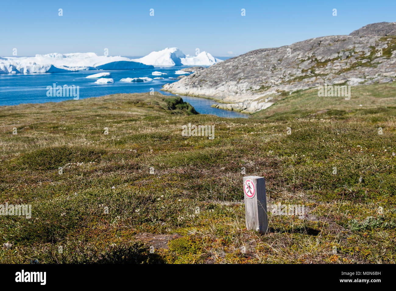 'No Walking' sign to protect the Sermermiut Inuit settlement archaeological site and Arctic Tundra habitat around Ilulissat Icefjord. Greenland Stock Photo