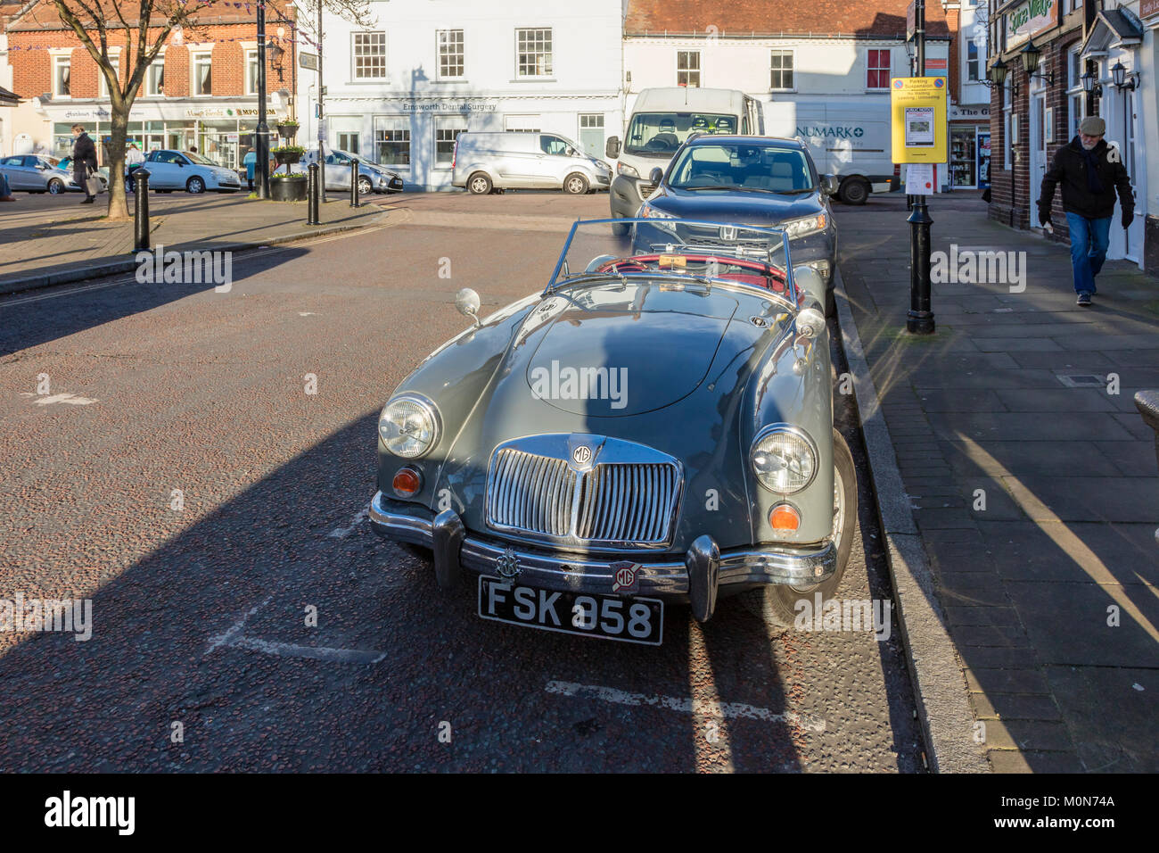 A MG sports car in the attractive St Peter's Square, Emsworth, in