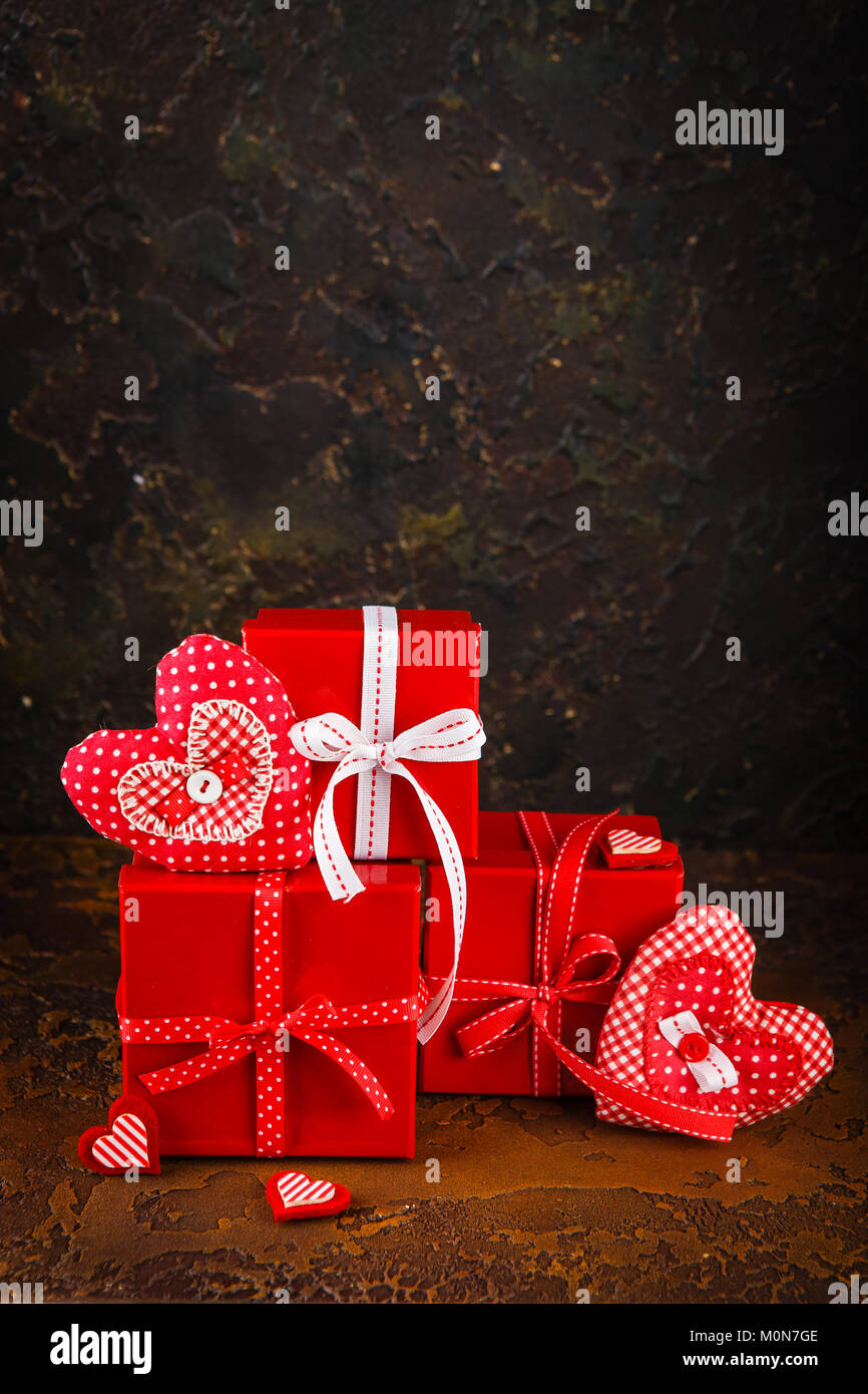 Red Handmaded Hearts And Gift Boxes On brown Concrete Background ...