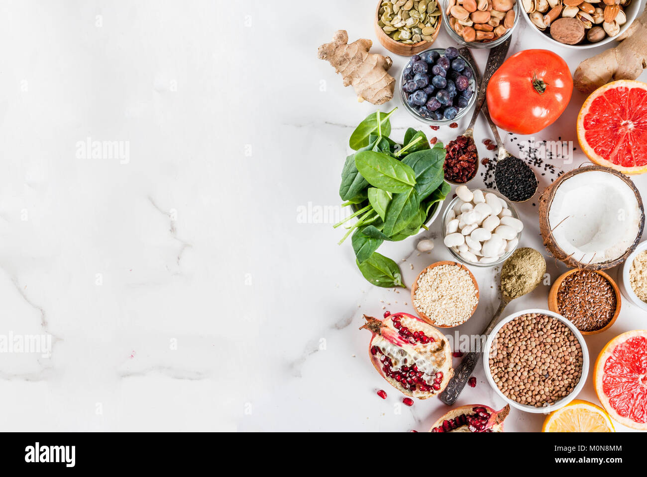 Set of organic healthy diet food, superfoods beans, legumes, nuts, seeds, greens, fruit and