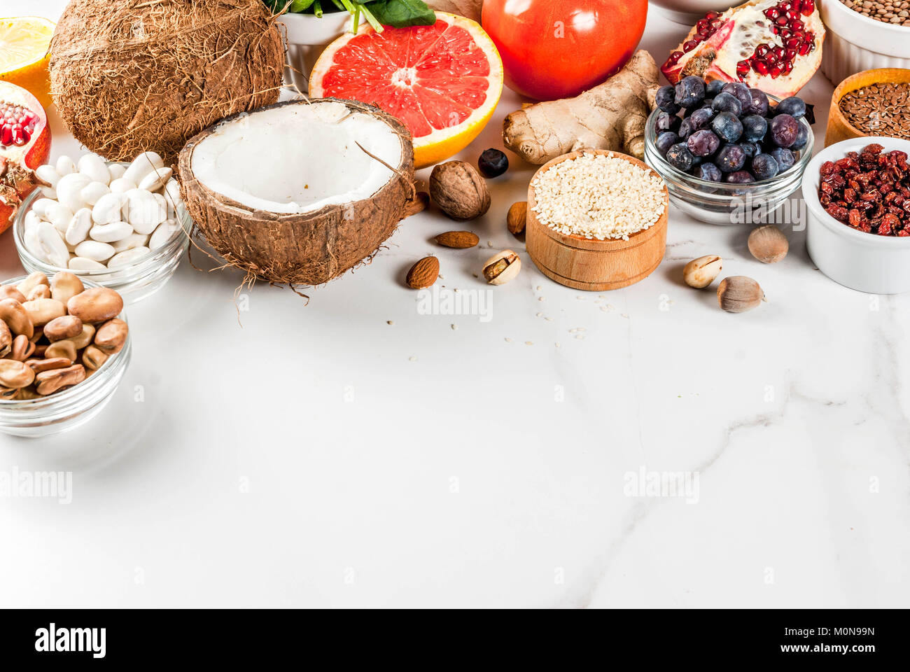 Set of organic healthy diet food, superfoods beans, legumes, nuts, seeds, greens, fruit and