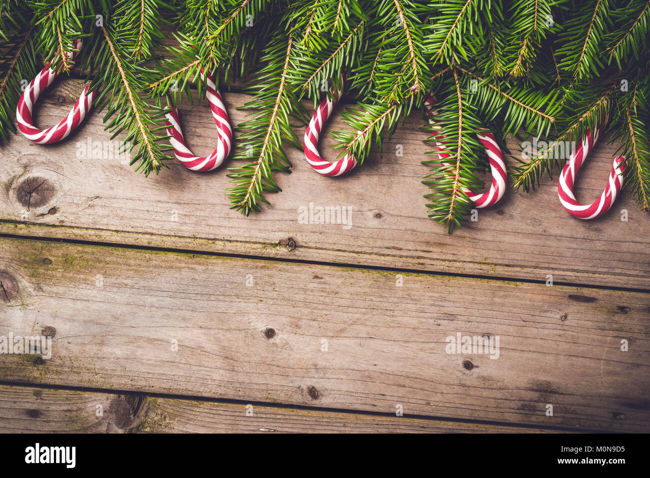 Christmas background with tree and candy canes Stock Photo - Alamy