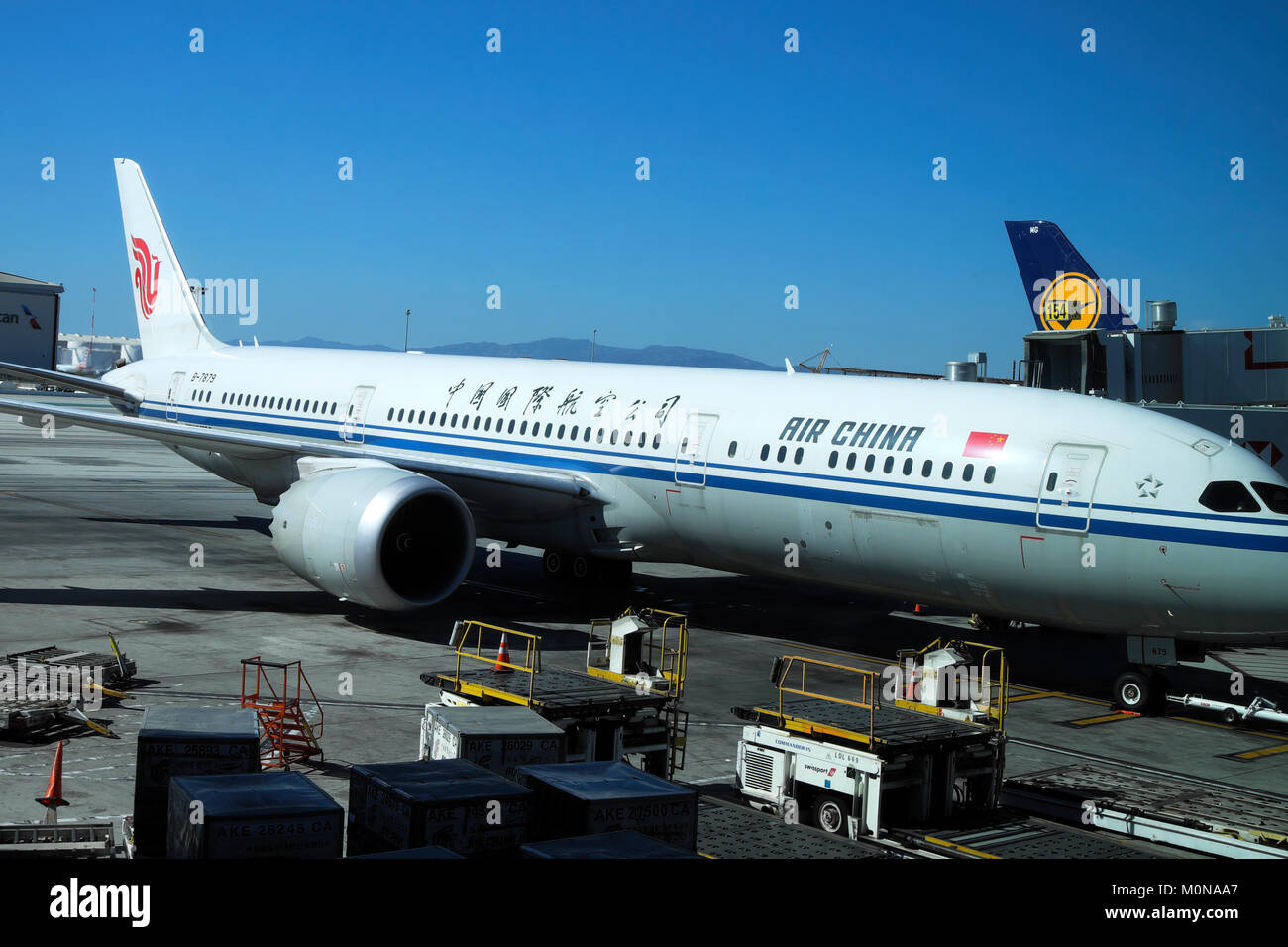 Air China Airlines plane standing on the tarmac being serviced