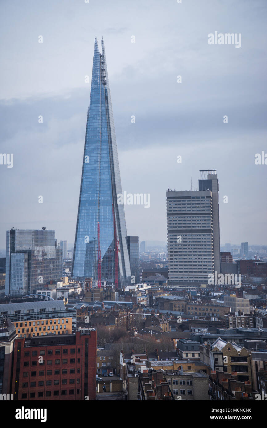 The Shard skyscraper with grey clouds in the sky. Stock Photo