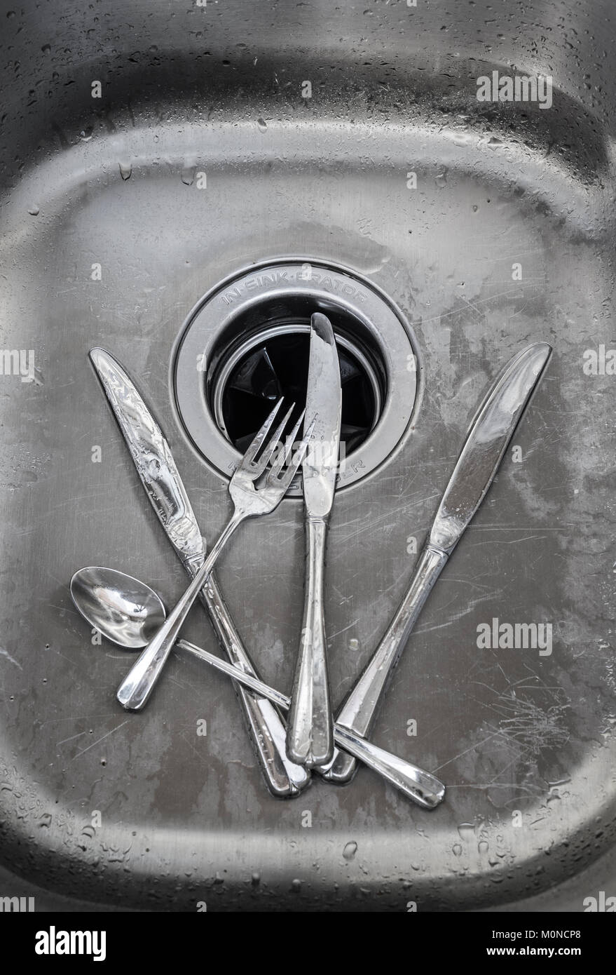 Silverware Knives Fork & Spoon In Sink Stock Photo