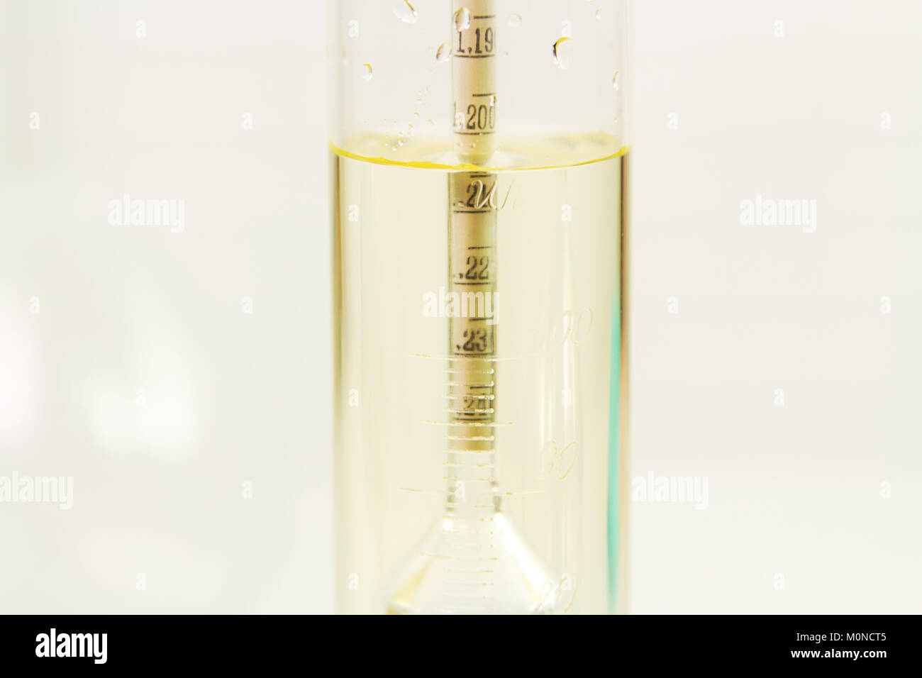 Measurement of solution density with a hydrometer, closeup Stock Photo