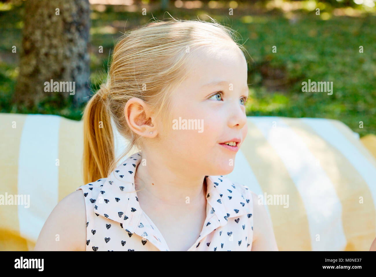 Portrait of blond girl outdoors Stock Photo - Alamy