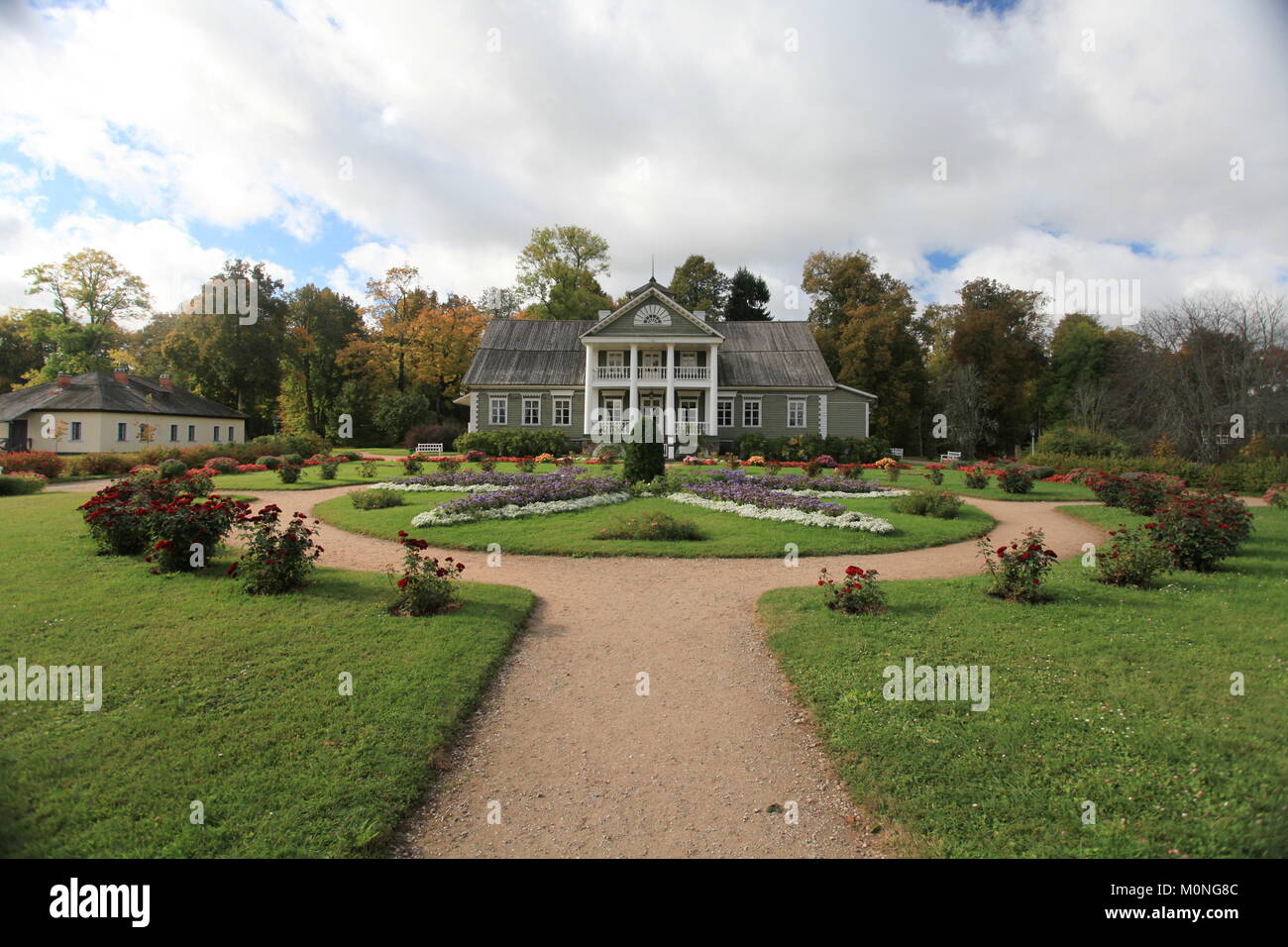 Beautiful flower garden in front of the farmhouse Stock Photo - Alamy