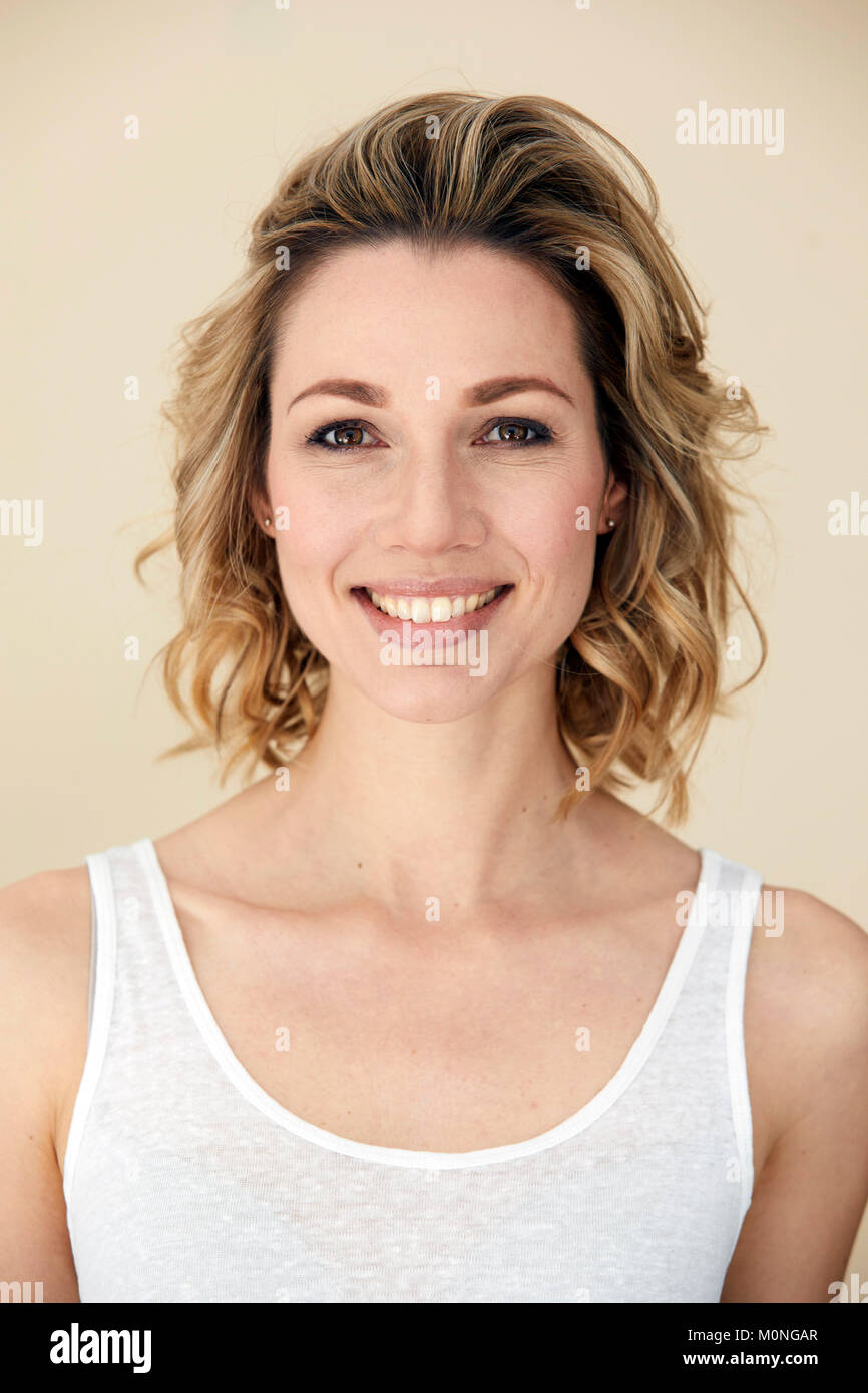 Female wearing beige top hi-res stock photography and images - Alamy