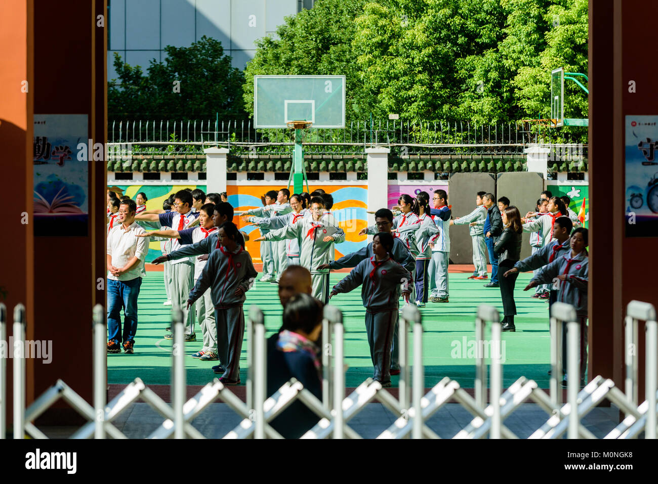 Shanghai, China. Students practiec moring Tai Chi at school in Shanghai, China. Credit: Benjamin Ginsberg Stock Photo