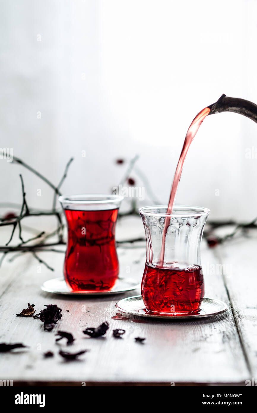 Pouring hollyhock tea in tea glass Stock Photo Alamy