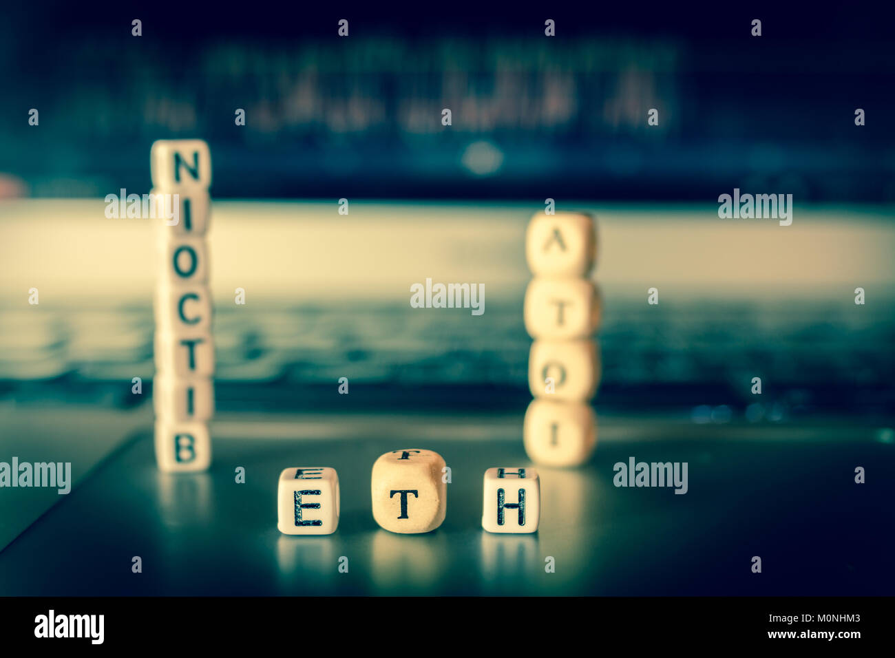 Small dices on laptop showing Bitcoin IOTA and Ethereum letters, toned  Stock Photo - Alamy