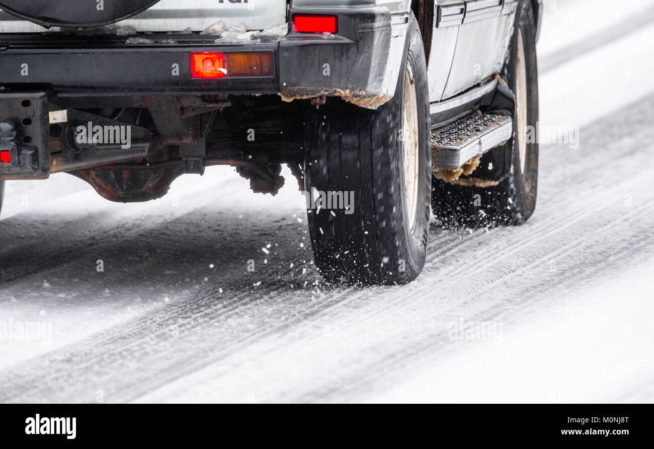 Series 1 land rover discovery driving down a snowy and icy road, Stock Photo