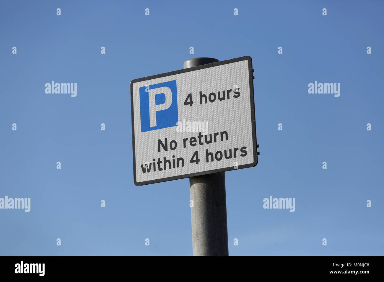 A 4 hours parking sign on a post in London, UK. Stock Photo