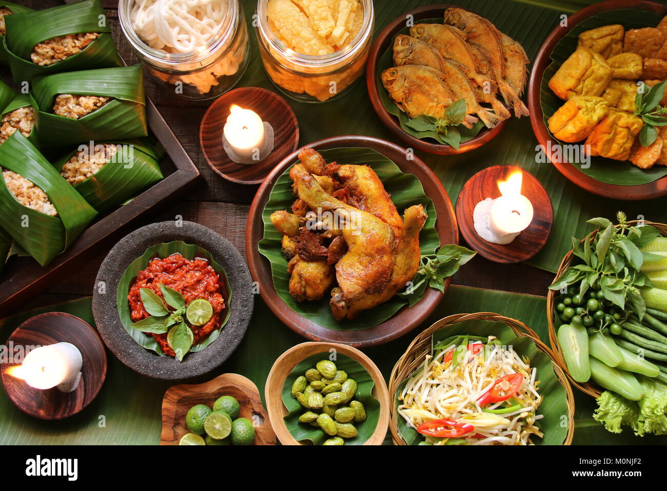 Nasi Tutug Oncom, the Sundanese Dish of Rice with Fermented Soybeans; Served with Variety of Side Dishes Stock Photo