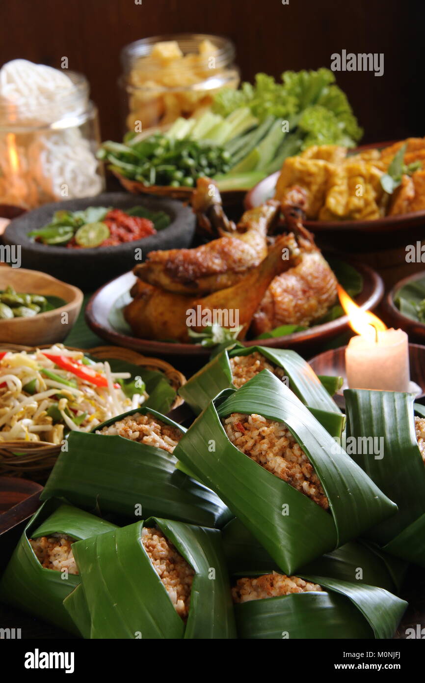 Nasi Tutug Oncom, the Sundanese Dish of Rice with Fermented Soybeans; Served with Variety of Side Dishes Stock Photo