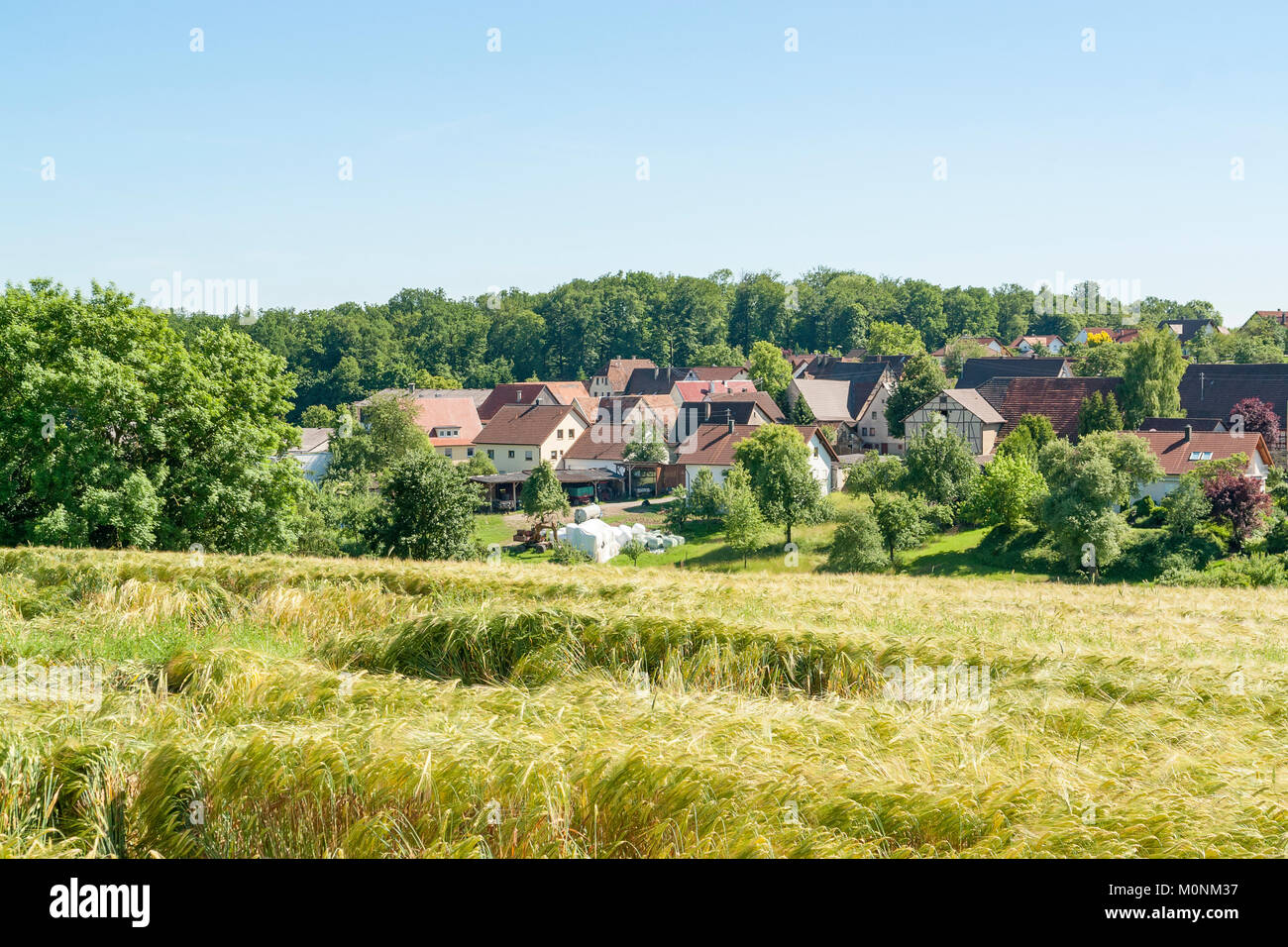 idyllic rural village named Schleierhof located in the Hohenlohe district in Southern Germany at summer time Stock Photo