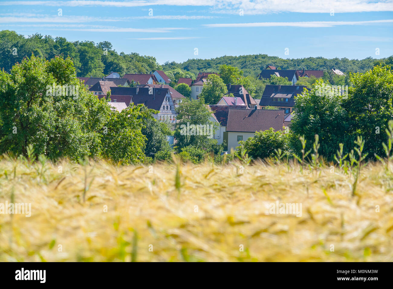 idyllic rural village named Schleierhof located in the Hohenlohe district in Southern Germany at summer time Stock Photo