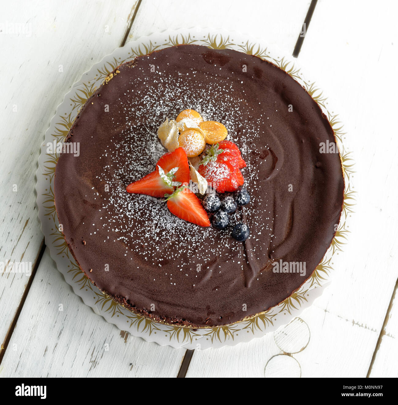 Chocolate cake with strawberries and blueberries Stock Photo