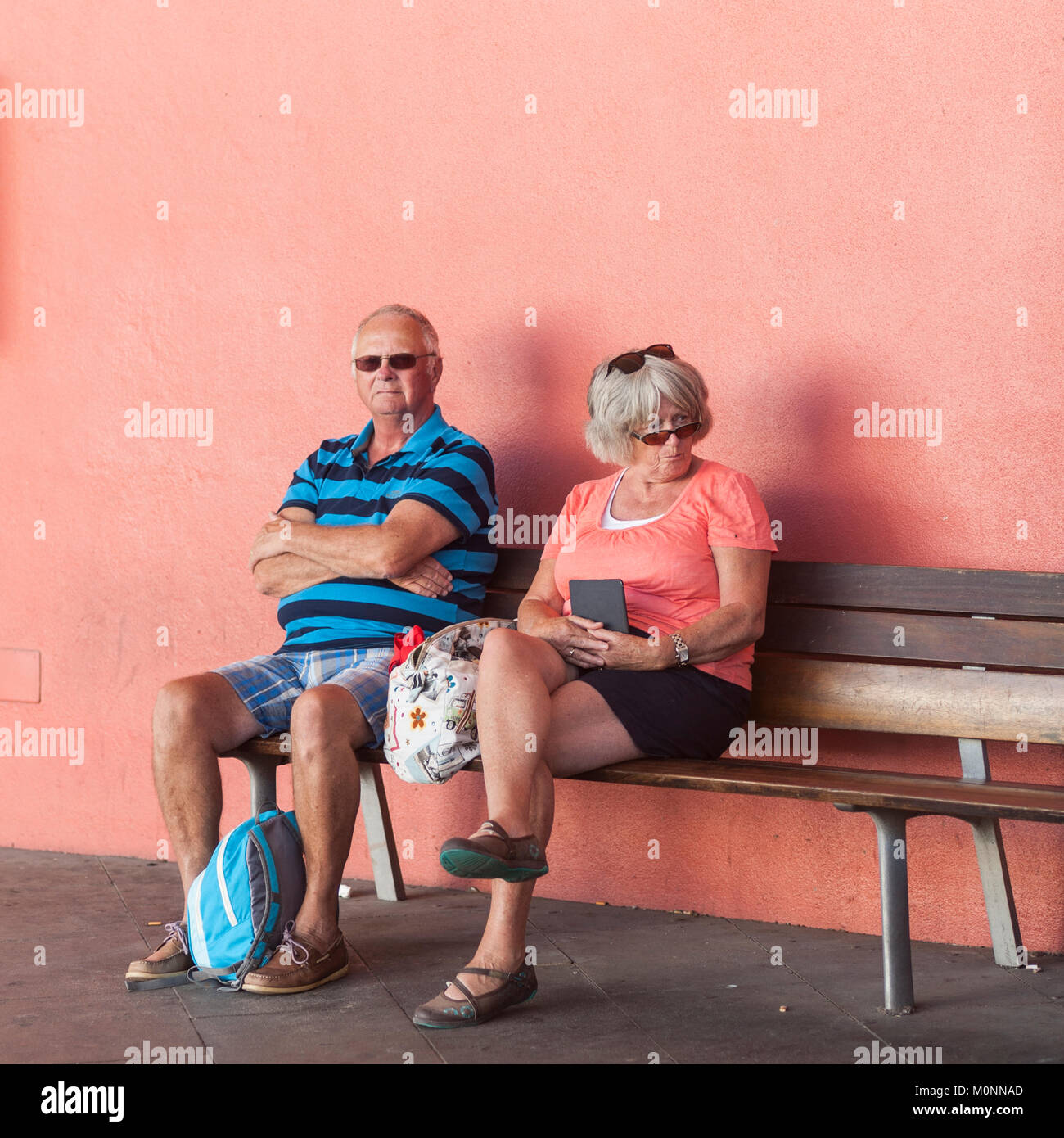 People waiting for a bus at the bus station in Mahon , Menorca , Balearic Islands , Spain Stock Photo