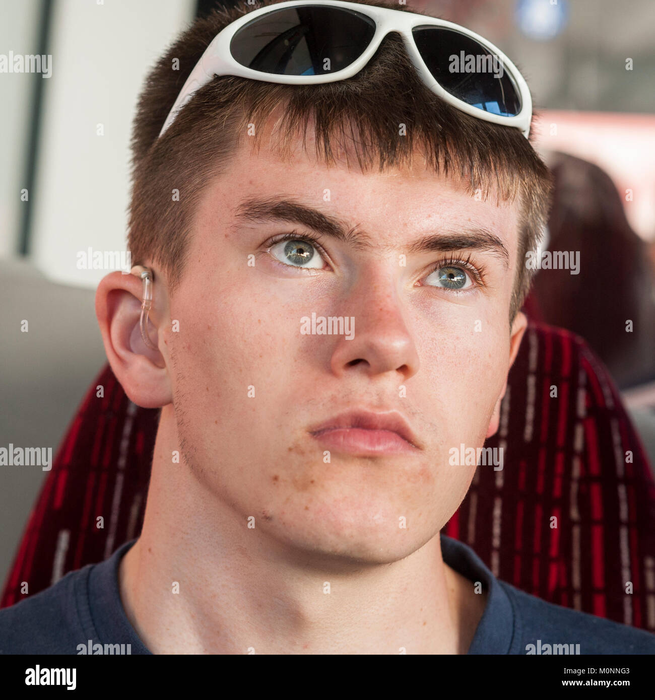 A teenage boy on a bus Stock Photo