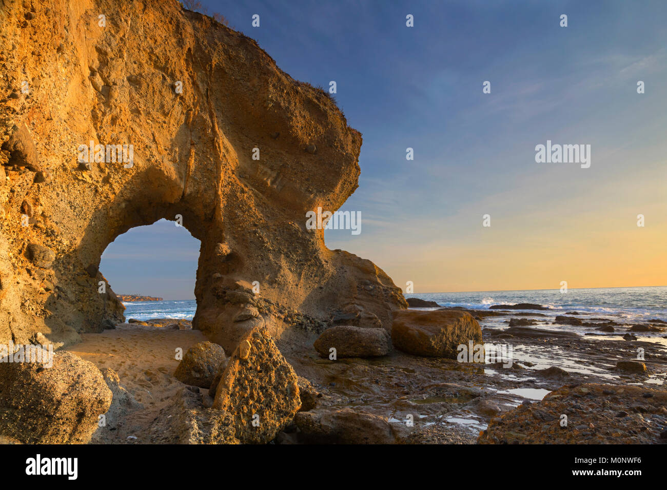Natural Rock Arch at Treasure Island Beach in Laguna Niguel, California Stock Photo