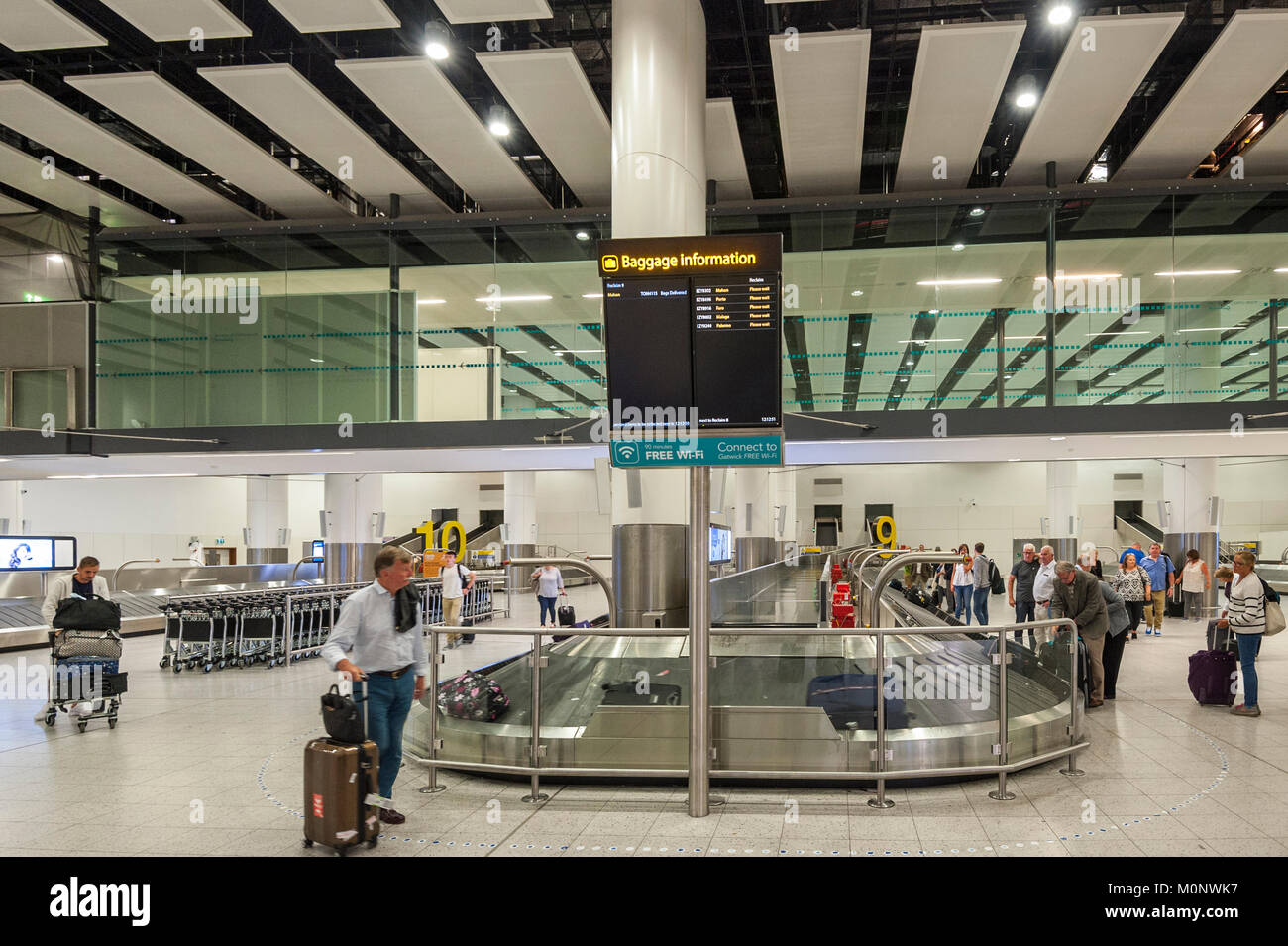 Waiting for luggage at the North Terminal at Gatwick airport , London