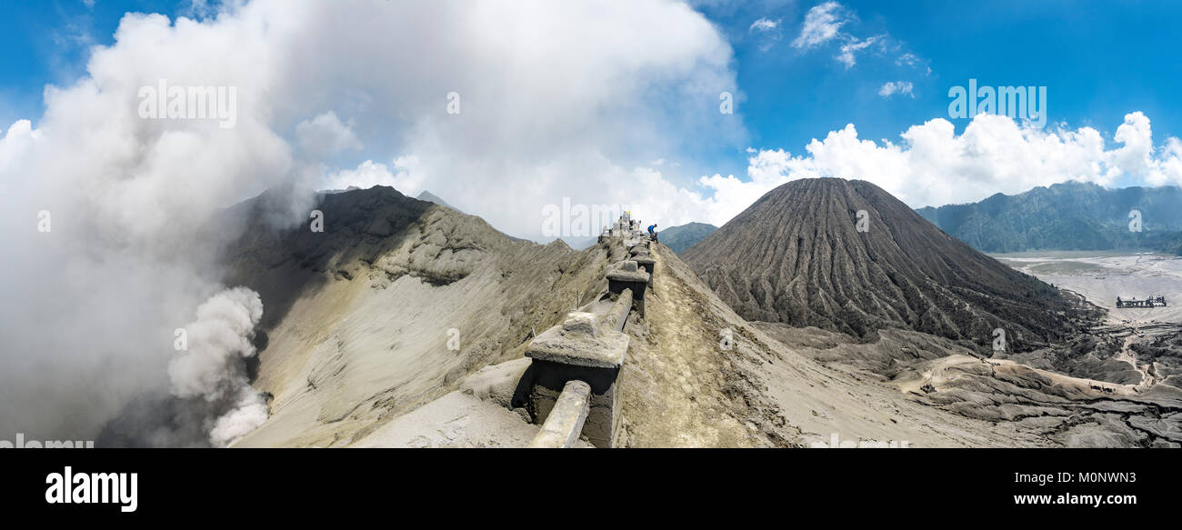 Crater rim of the smoking volcano Gunung Bromo,in the back Mt. Batok ...