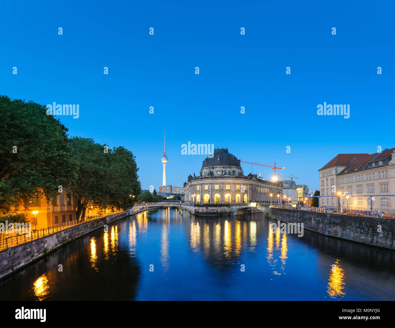 Night time illuminations of Museum Island in Berlin, Germany. Panorama image, that has been tinted. Stock Photo