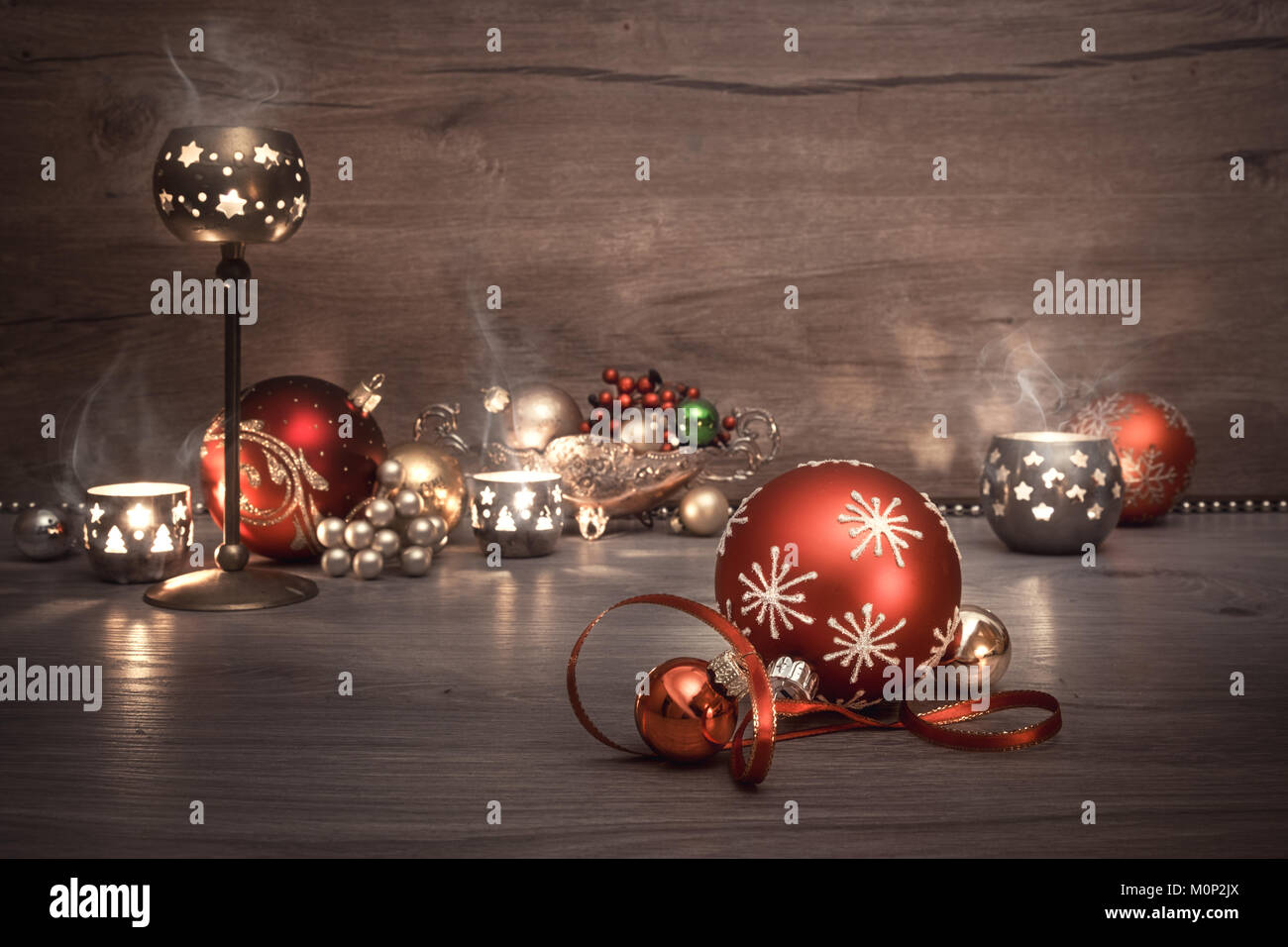 Vintage Christmas background with candles and Christmas baubles, caption "Merry Chistmas!". This