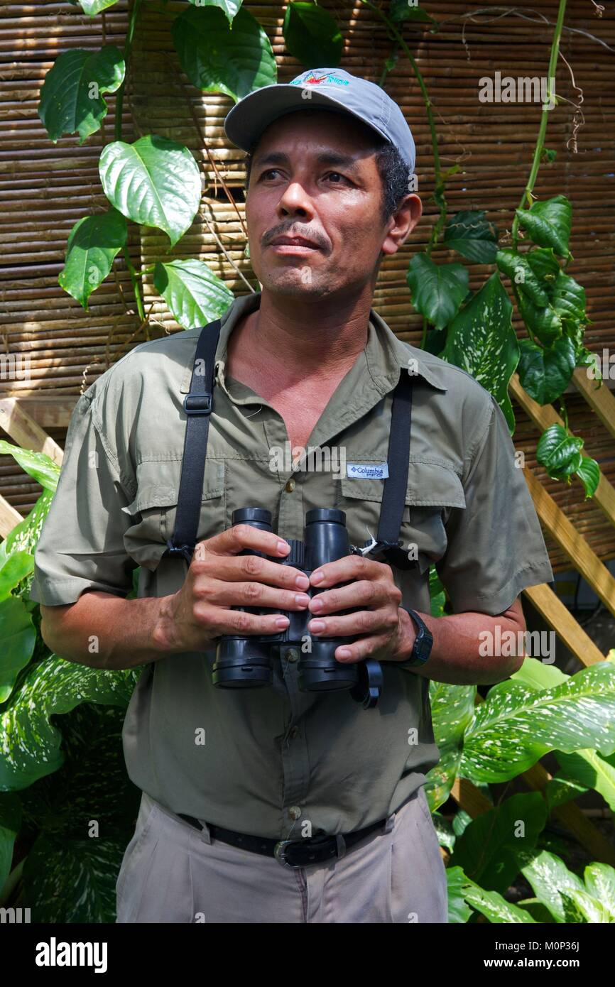 Costa Rica,Osa peninsula,naturalist guide in binoculars in hand in the