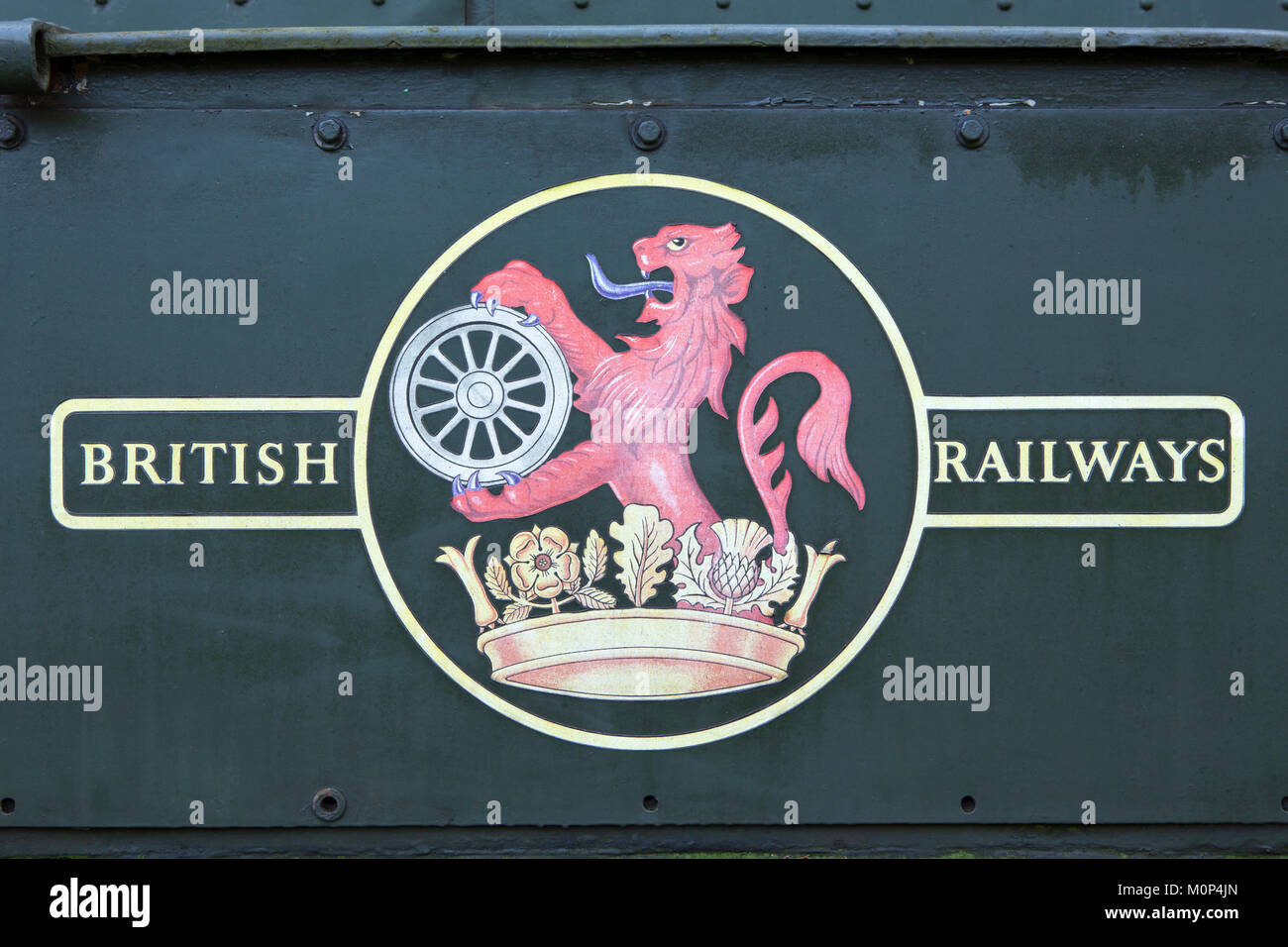 British Railways logo set on a green background. Lion wheel and heraldry crown symbols used between 1956 and 1965. Stock Photo
