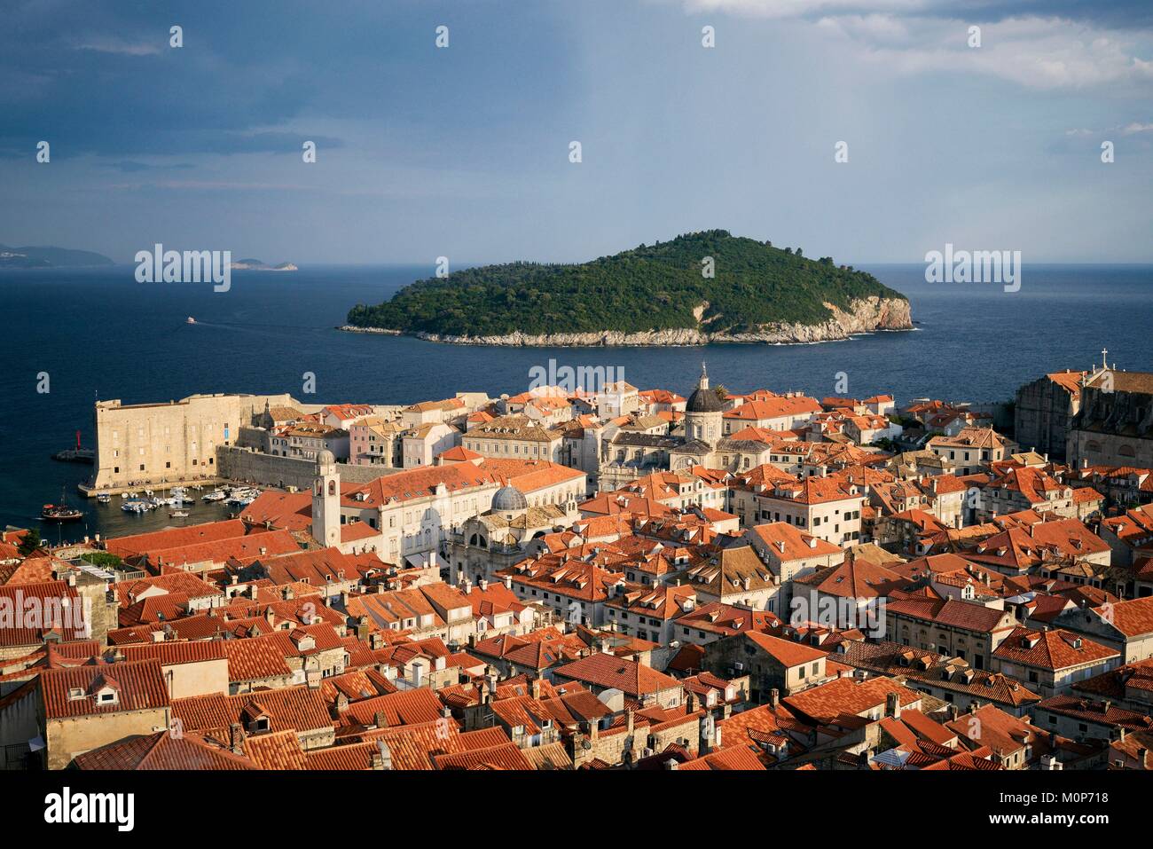 Croatia,Dalmatia,Dalmatian Coast,Dubrovnik,historical centre listed as World Heritage by UNESCO,city rooftops and the dome of the Assumption cathedral,Lokrum island in the distance Stock Photo