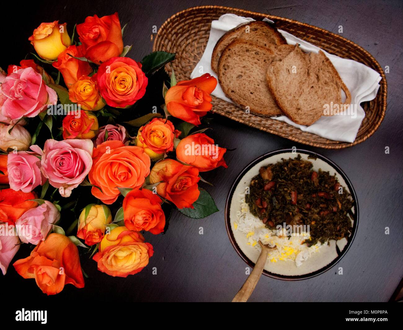 France,Paris,Bouquet of roses and traditional Iranian dish,the Ghormeh