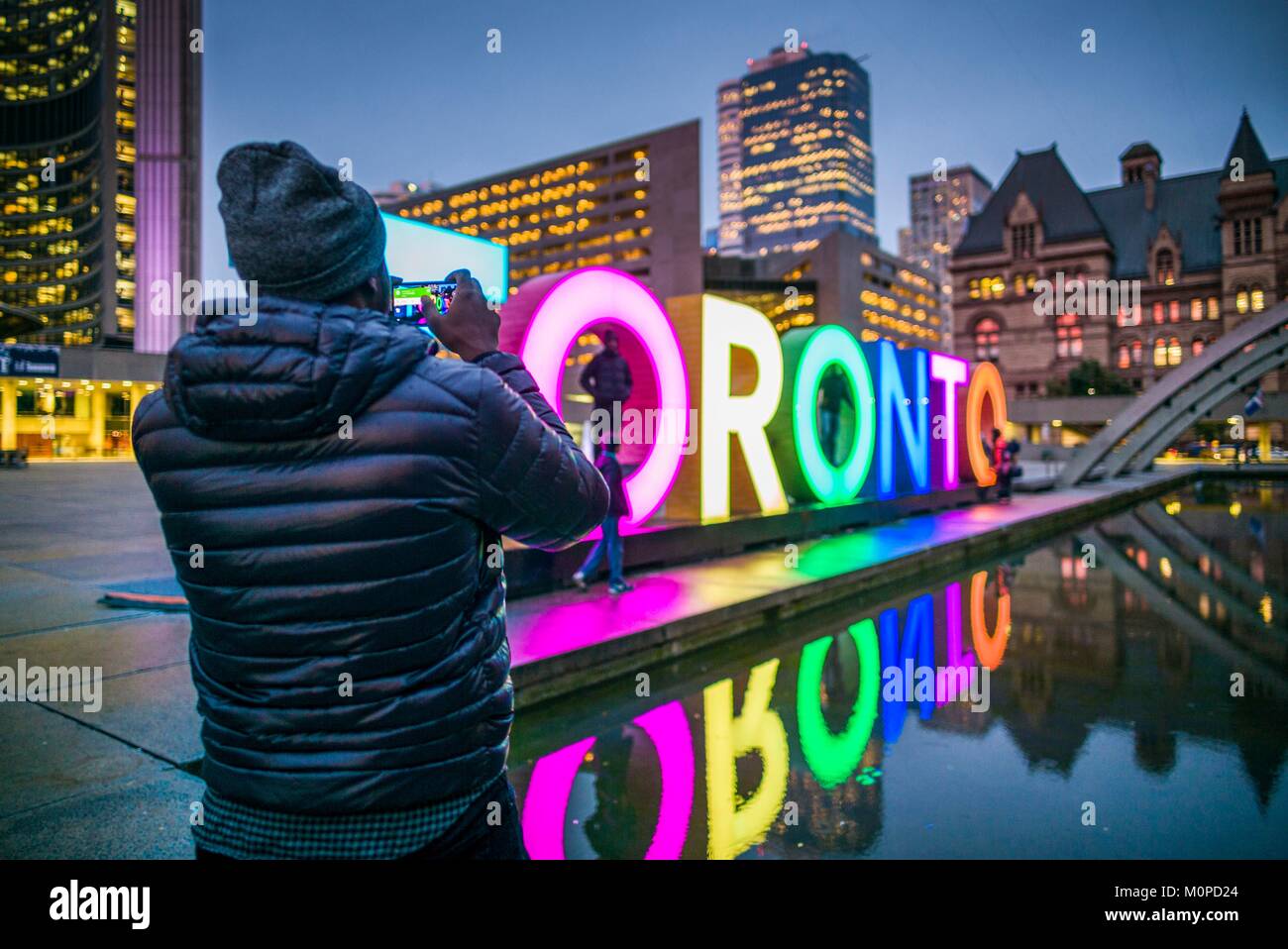 Canada,Ontario,Toronto,Toronto Sign in Nathan Phillips Square by the City Hall,dusk Stock Photo