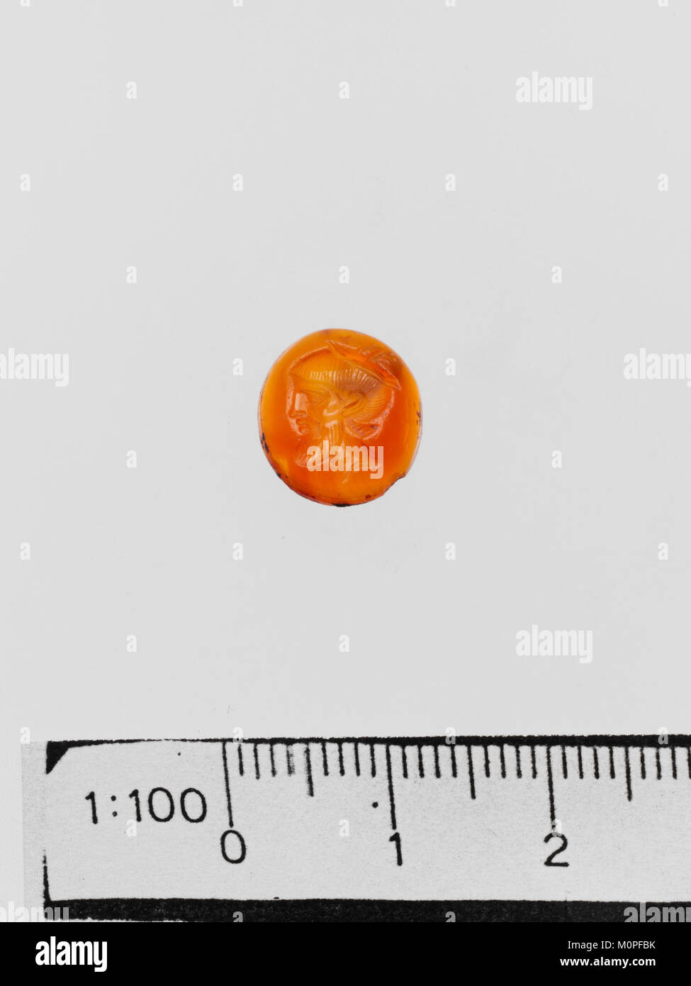 A carnelian ring stone, an engraved gem, from the collection of the Metropolitan Museum of Art. This artifact showcases the intricate craftsmanship of ancient artisans. Stock Photo