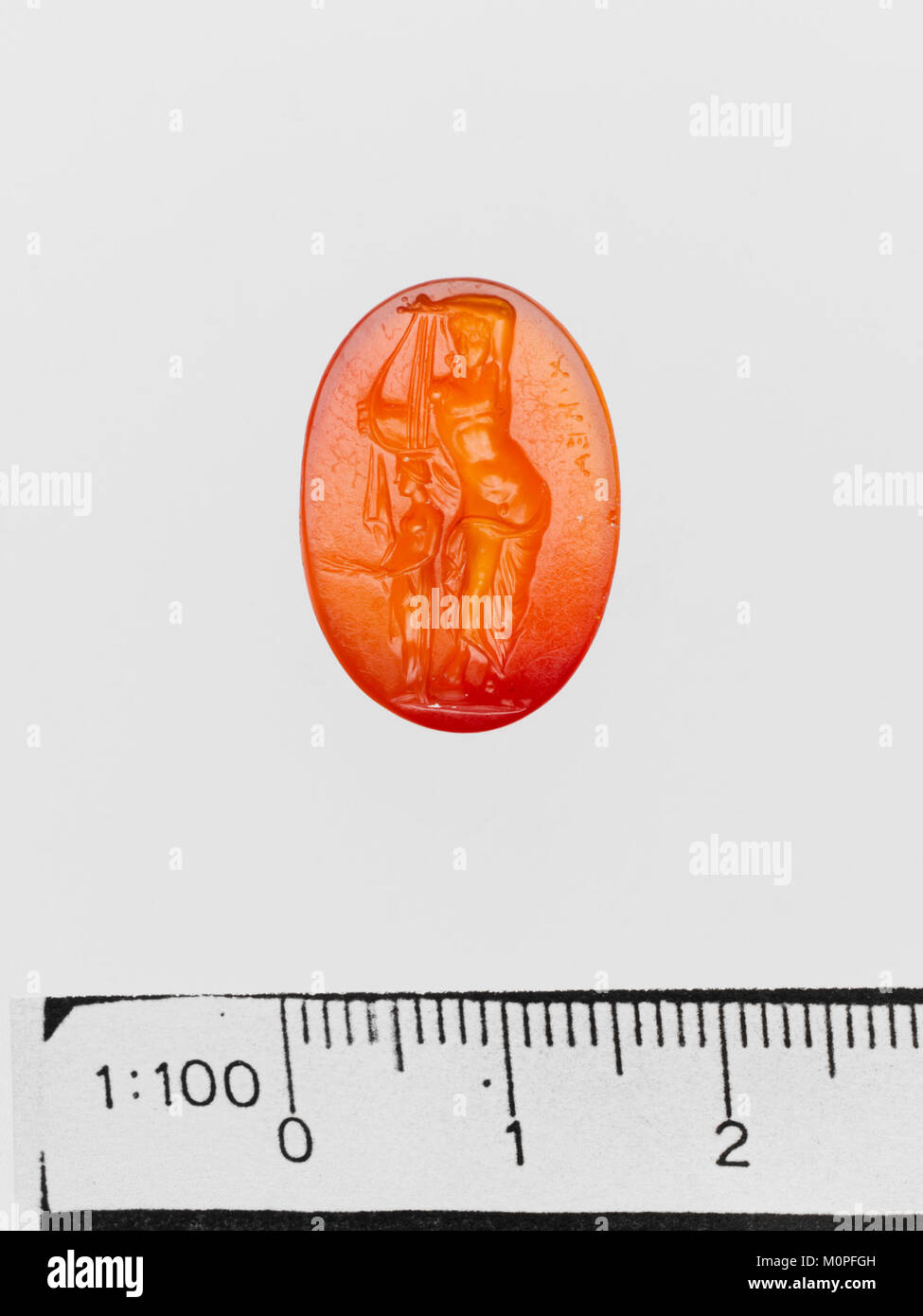 This carnelian ring stone, from the Metropolitan Museum of Art, showcases the skillful carving techniques of ancient artisans. Carnelian, a semi-precious stone, was used for seals and jewelry in antiquity. Stock Photo