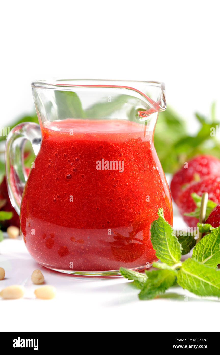 Strawberry fresh sauce with mint and lime. Vertical shot. Closeup