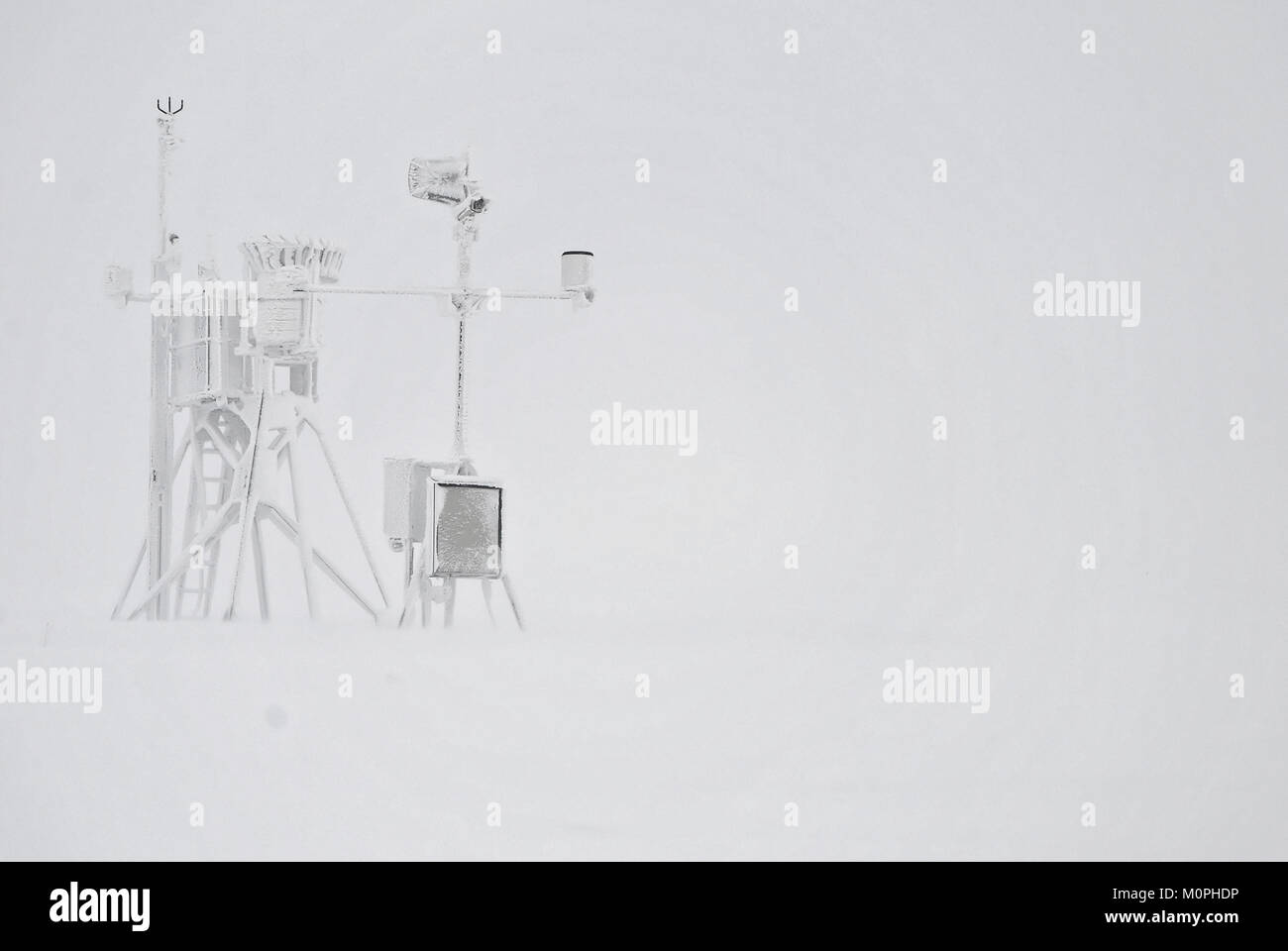 Professional weather station covered with ice during a blizzard Stock Photo