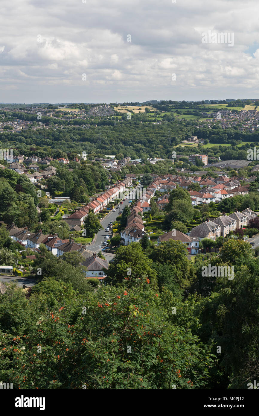 Panoramic urban scene - Baildon town (foreground residential suburban semi-detached houses) in green leafy setting - Bradford, Yorkshire, England, UK Stock Photo