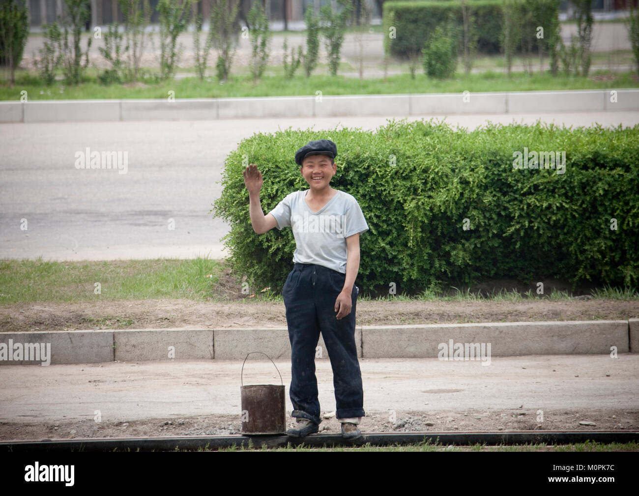 Smiling North Korean Teenage Boy Waving Hello In The Street Pyongan