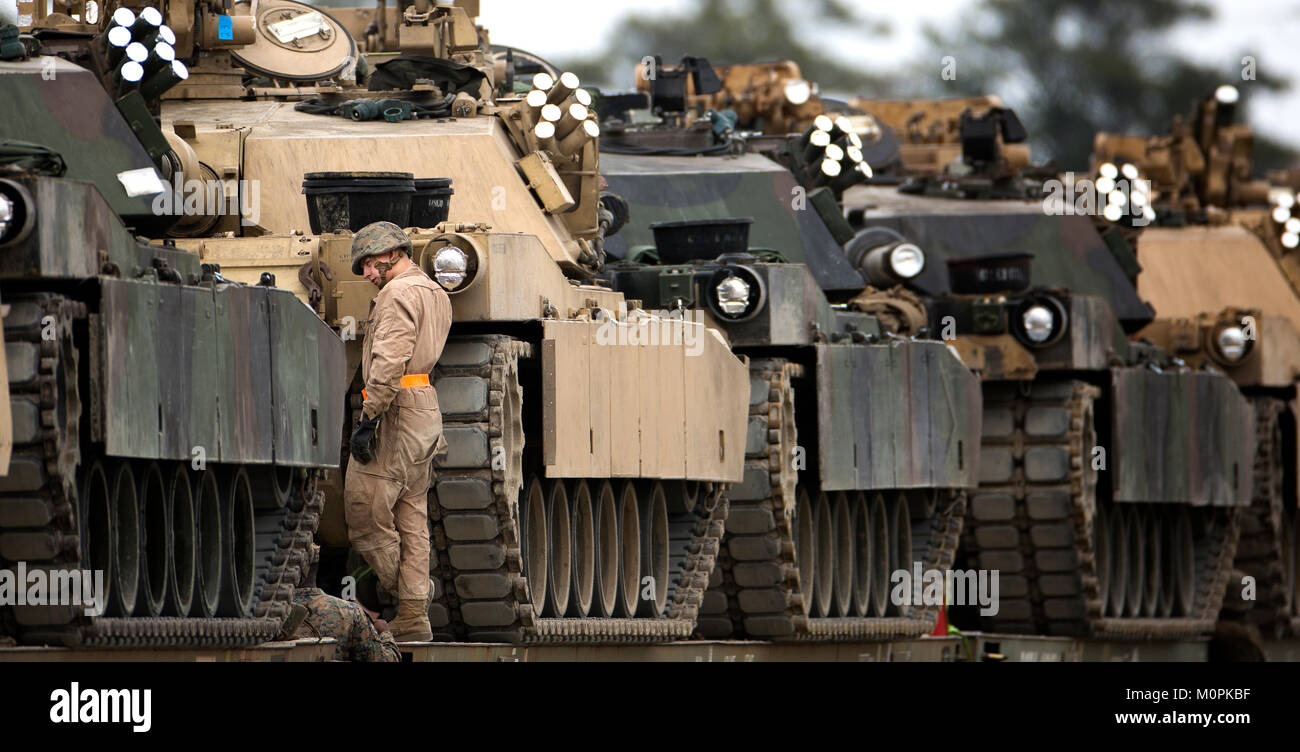 Marines with 2nd Tank Battalion, 2nd Marine Division secure M1A1 battle tanks to train cars for transport to Fort Stewart, Ga., for a training exercise Jan. 22, 2017 on Marine Corps Base Camp Lejeune, N.C. Stock Photo