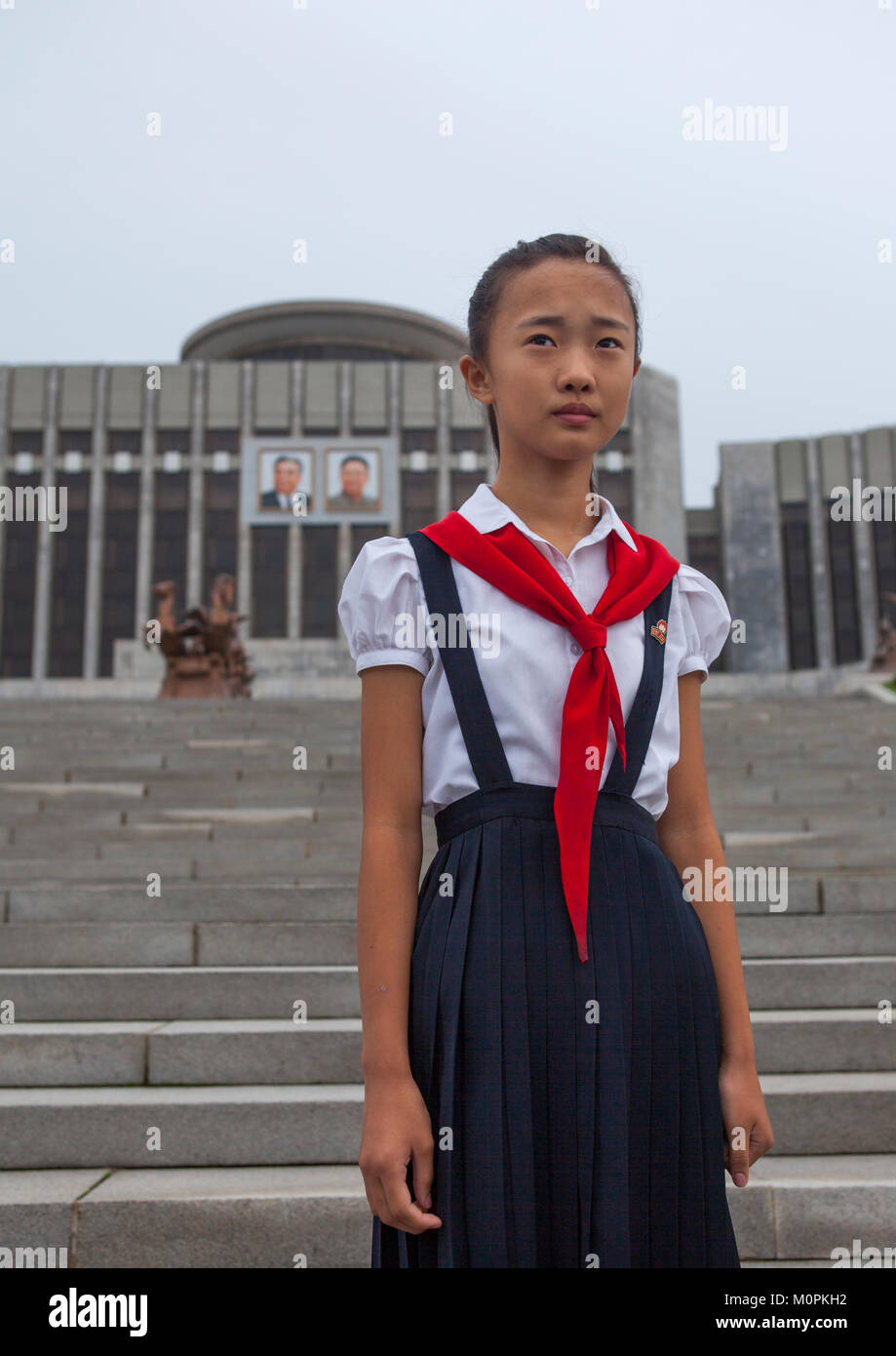 North Korean Pioneer Girl In Front Of Mangyongdae Children S Palace   North Korean Pioneer Girl In Front Of Mangyongdae Childrens Palace M0PKH2 