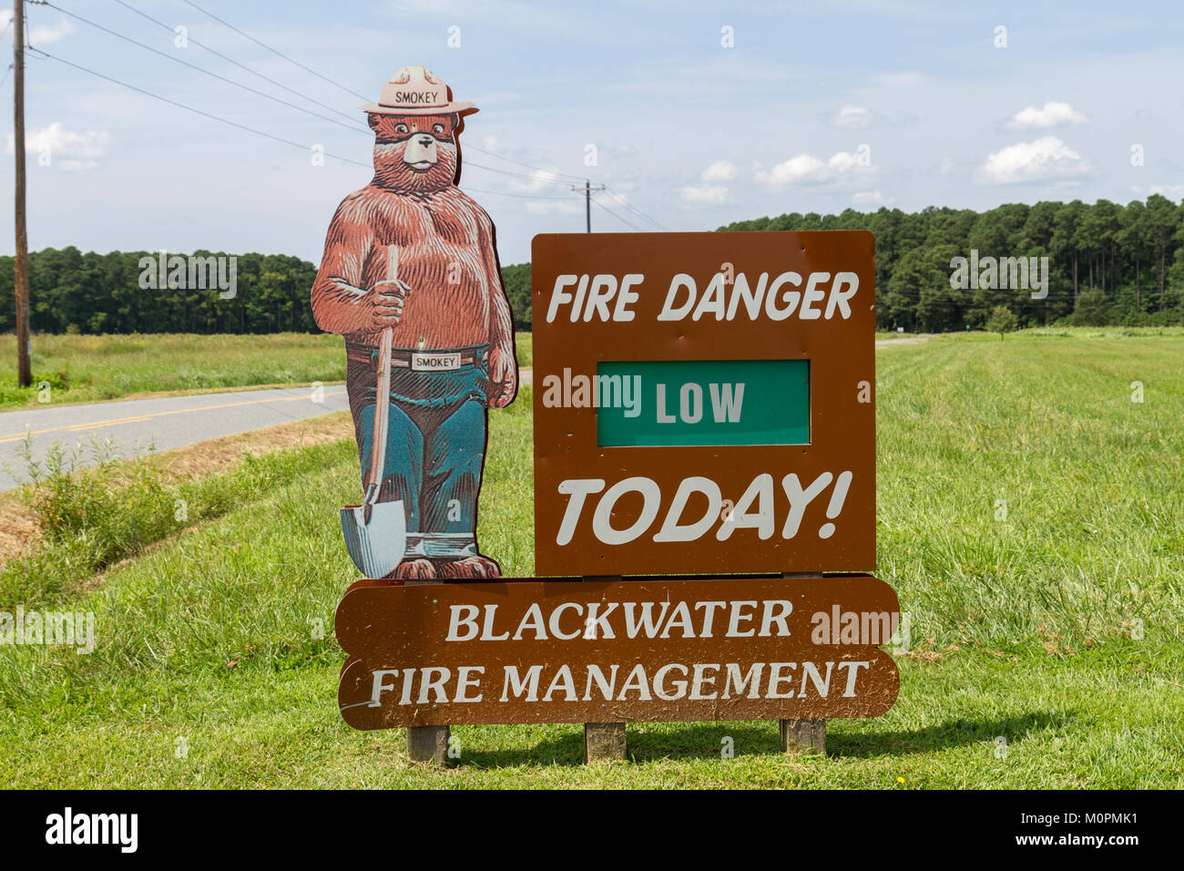 A Fire Danger fire management road side sign (indicating the fire risk is 'Low'), in Blackwater, Maryland, United States. Stock Photo
