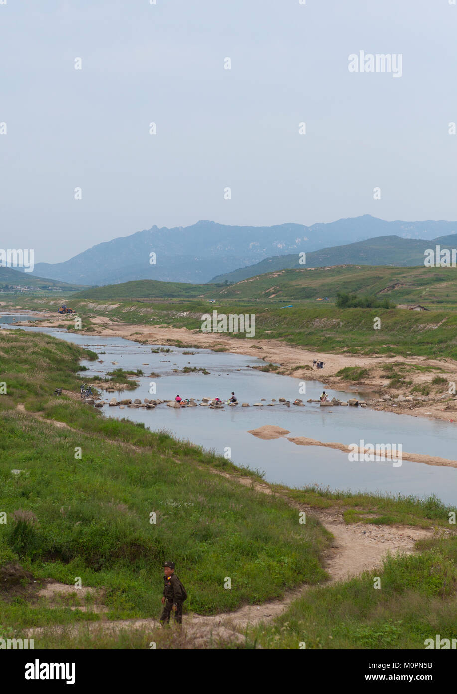 North Korean people washing clothes in a river, North Hwanghae Province